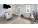 Living room with a view through the french doors to the outside porch at 2278 Jon Chris Dr, Harrisburg, NC 28075