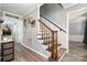 A welcoming staircase with wooden treads and spindles, complemented by neutral wall colors at 2278 Jon Chris Dr, Harrisburg, NC 28075