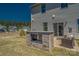 Backyard featuring a stone outdoor kitchen and outdoor seating on a brick patio at 247 Tackle Box Dr, Troutman, NC 28166
