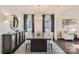 Elegant dining room with dark hardwood floors, modern chandelier, and sophisticated decor at 247 Tackle Box Dr, Troutman, NC 28166