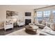 Bright and inviting living room with a fireplace, plush seating, and large windows at 247 Tackle Box Dr, Troutman, NC 28166