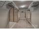 Spacious walk-in closet with ample shelving, garment bags and carpeted floor at 247 Tackle Box Dr, Troutman, NC 28166