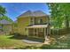 Exterior view of the back of the home featuring a screened-in porch and manicured lawn at 2544 Barrington Ct, Rock Hill, SC 29732
