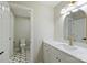 Elegant bathroom boasts a modern vanity with white marble counters, gold fixtures, and unique decorative floor tiles at 2544 Barrington Ct, Rock Hill, SC 29732
