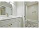 Stylish bathroom featuring white cabinets, marble countertops, gold fixtures and a shower/tub combination with modern tiling at 2544 Barrington Ct, Rock Hill, SC 29732