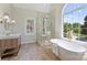 Bright bathroom featuring a soaking tub, a glass enclosed shower, and double vanities at 2544 Barrington Ct, Rock Hill, SC 29732