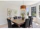Bright dining room featuring a wooden table, seating for six, a pendant light, and large windows at 2544 Barrington Ct, Rock Hill, SC 29732