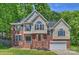Charming two-story home with brick and vinyl siding, complemented by a well-manicured lawn and black shutters at 2544 Barrington Ct, Rock Hill, SC 29732