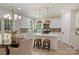 Bright kitchen features white cabinets, stainless appliances, island with breakfast bar, and an adjacent dining area at 2544 Barrington Ct, Rock Hill, SC 29732