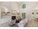 Bright living room with a fireplace, built-in shelves, large windows, and comfortable seating at 2544 Barrington Ct, Rock Hill, SC 29732