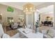 Inviting living room featuring a stylish chandelier, comfortable seating, and views into the dining and office areas at 2544 Barrington Ct, Rock Hill, SC 29732