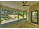 Cozy screened-in porch provides an excellent view of the spacious, tree-lined backyard with access to a wooden staircase at 2544 Barrington Ct, Rock Hill, SC 29732