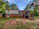 Home's backyard featuring a small deck and wooded area at 269 Bud Black Rd, Crouse, NC 28033