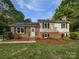 Charming brick home with manicured lawn, black shutters, and a welcoming front entrance at 269 Bud Black Rd, Crouse, NC 28033