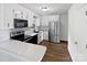 Modern kitchen with stainless steel appliances, white cabinets, and a black countertop at 269 Bud Black Rd, Crouse, NC 28033