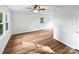 Room with hardwood floors, a ceiling fan, window, and a door at 269 Bud Black Rd, Crouse, NC 28033