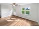 Spacious room with hardwood floors, a ceiling fan, and natural light streaming through the window at 269 Bud Black Rd, Crouse, NC 28033