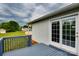 Back deck with gray wooden planks and white sliding glass doors to the home's interior at 301 Walkers Ridge Dr, Shelby, NC 28152