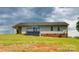 Home's backyard featuring a small deck and vinyl siding at 301 Walkers Ridge Dr, Shelby, NC 28152