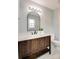 This bathroom has an undermount sink, lots of drawers, and a black framed mirror at 301 Walkers Ridge Dr, Shelby, NC 28152
