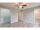 Bright bedroom features a ceiling fan, walk-in closet and modern ensuite bathroom with tub at 301 Walkers Ridge Dr, Shelby, NC 28152