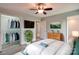 Comfortable bedroom featuring a fan, television, decor, a walk-in closet and modern ensuite bathroom at 301 Walkers Ridge Dr, Shelby, NC 28152