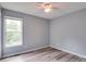 Bright bedroom with a ceiling fan, window providing natural light, and light gray walls at 301 Walkers Ridge Dr, Shelby, NC 28152