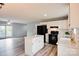 Bright kitchen with white cabinets, an island, modern appliances and a seamless flow into the living space at 301 Walkers Ridge Dr, Shelby, NC 28152