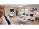 Bright living room with hardwood floors, modern furnishings, and large windows offering ample natural light at 301 Walkers Ridge Dr, Shelby, NC 28152