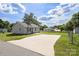 View of backyard with large parking pad and detached garage potential at 318 Huffman Rd, Gastonia, NC 28056