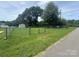 Fenced-in backyard with well-maintained lawn and storage shed at 318 Huffman Rd, Gastonia, NC 28056