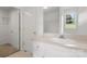 Bright bathroom with large mirror over vanity with storage at 318 Huffman Rd, Gastonia, NC 28056