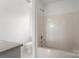 Bright bathroom features a shower-tub, neutral finishes, and modern fixtures at 318 Huffman Rd, Gastonia, NC 28056