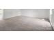 Spacious carpeted bedroom with natural light and ample space at 318 Huffman Rd, Gastonia, NC 28056