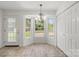 Bright breakfast nook features a bay window, chandelier, and convenient closet storage at 318 Huffman Rd, Gastonia, NC 28056