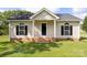 Charming single-story home featuring a well-maintained lawn and classic architecture at 318 Huffman Rd, Gastonia, NC 28056