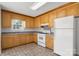Functional kitchen with tile floor, ample cabinets, and room for appliances at 318 Huffman Rd, Gastonia, NC 28056