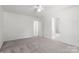 Spacious main bedroom with neutral carpet with ensuite bathroom at 318 Huffman Rd, Gastonia, NC 28056