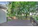 Enjoy outdoor relaxation on this deck with views of the landscaped backyard at 3226 Chatfield Sw Ln, Concord, NC 28027