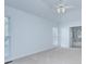 Bright bedroom with plush carpet, ceiling fan, and ensuite bathroom access at 3226 Chatfield Sw Ln, Concord, NC 28027