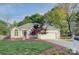 Charming single-story home with well-manicured lawn, mature trees, and attached two car garage at 3226 Chatfield Sw Ln, Concord, NC 28027