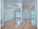 Spacious, light-filled living room features gleaming hardwood floors, high ceilings and chandelier lighting at 3226 Chatfield Sw Ln, Concord, NC 28027