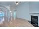 Bright living room boasts a fireplace, hardwood floors, and an open concept layout to the front entry at 3226 Chatfield Sw Ln, Concord, NC 28027