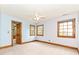 Light-filled bedroom with three windows and wooden trim at 3231 Karen Ln, Monroe, NC 28110