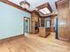 Beautiful kitchen with wood floors, cabinets and appliances, island cooktop, and a skylight at 3231 Karen Ln, Monroe, NC 28110