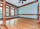 Bright living room featuring hardwood floors, light blue walls and abundant natural light from large windows with wood trim at 3231 Karen Ln, Monroe, NC 28110