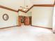 Spacious main bedroom with high ceilings, trim and decorative doors to other rooms at 3231 Karen Ln, Monroe, NC 28110