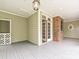 Covered porch with brick detail and double doors to the interior at 3231 Karen Ln, Monroe, NC 28110