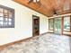 Bright sunroom featuring wood ceiling, tile floors, and access to the backyard at 3231 Karen Ln, Monroe, NC 28110
