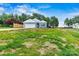 Beautiful, well-manicured lawn with a view of a home with blue siding and an attached garage at 3567 Farmfield Dr, Claremont, NC 28610